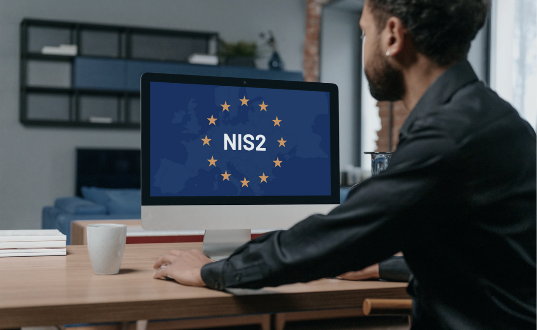 Person viewing a screen with the NIS2 logo surrounded by EU stars – representing upcoming cybersecurity requirements for businesses in Europe starting October 2024.