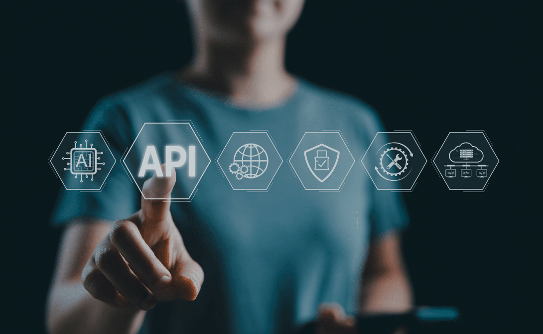 Developer working on API-first integration architecture in a modern workspace.